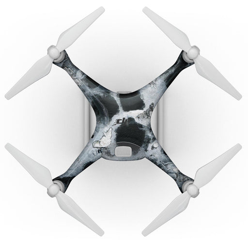 A top-down view of a DJI Phantom 4 Drone showcases its sleek design with four white propellers and a central body adorned with the Blue Leto Abstract Paint v4 Full-Body Skin Kit, featuring an elegant black and white marbled pattern. The drone appears to benefit from Bubble-FREE installation, further enhancing its sophisticated appearance.