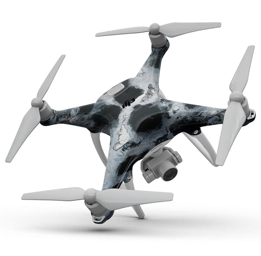 A sleek quadcopter drone with a black and white marbled design, four propellers, and a mounted camera on its underside. The Blue Leto Abstract Paint v4 Full-Body Skin Kit for the DJI Phantom 4 Drone gives it a striking look while in-flight against a white background.