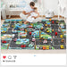 A father and child sit on the Lacatang Shop's Colorful Cartoon City Traffic Play Mat with Toy Cars, enjoying playful moments and boosting cognitive skills. The cozy room features a crib quietly in the background.