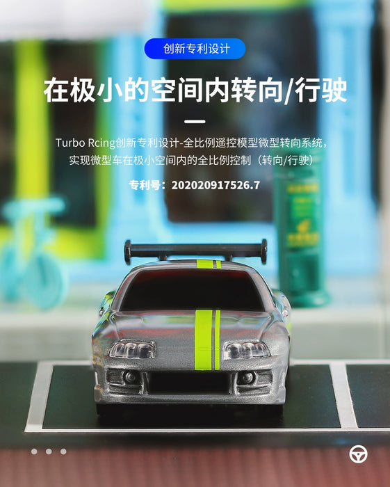 A miniature white and green sports car toy is displayed on a platform. The car, labeled "Turbo1/76 Miniature RC Remote Control Electric Sports Car," features a rear spoiler and racing stripes. Chinese text and numbers in the background describe the product from Lacatang Shop. The image highlights this Turbo1/76 micro RC remote control car's ability to turn and drive in small spaces, making it an ideal simulation Toyota mini desktop remote control vehicle for enthusiasts.