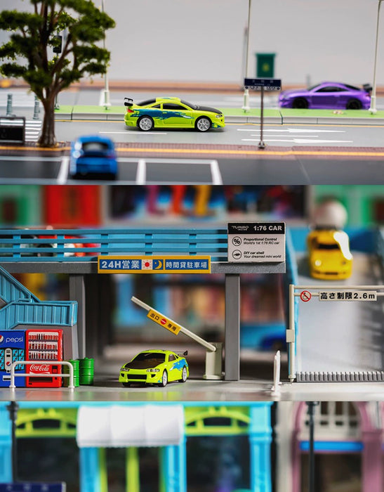 A detailed diorama of a city street with toy cars and structures. The top section showcases a road with a green electric sports car from Lacatang Shop and a purple Turbo1/76 Miniature RC Remote Control Electric Sports Car. The middle section displays a parking lot with signs and a yellow car. The bottom section features a toll booth with another Turbo1/76 Miniature RC Remote Control Electric Sports Car in green and black, complete with an RC remote control for enhanced simulation.