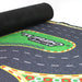 A rolled-up mat with "TURBO RACING" boldly on a green track. The Turbo Drift Remote Control Car Track by Lacatang Shop features textured black surface, yellow-red striped edges, and exciting turns and lanes for thrilling drifting experiences.