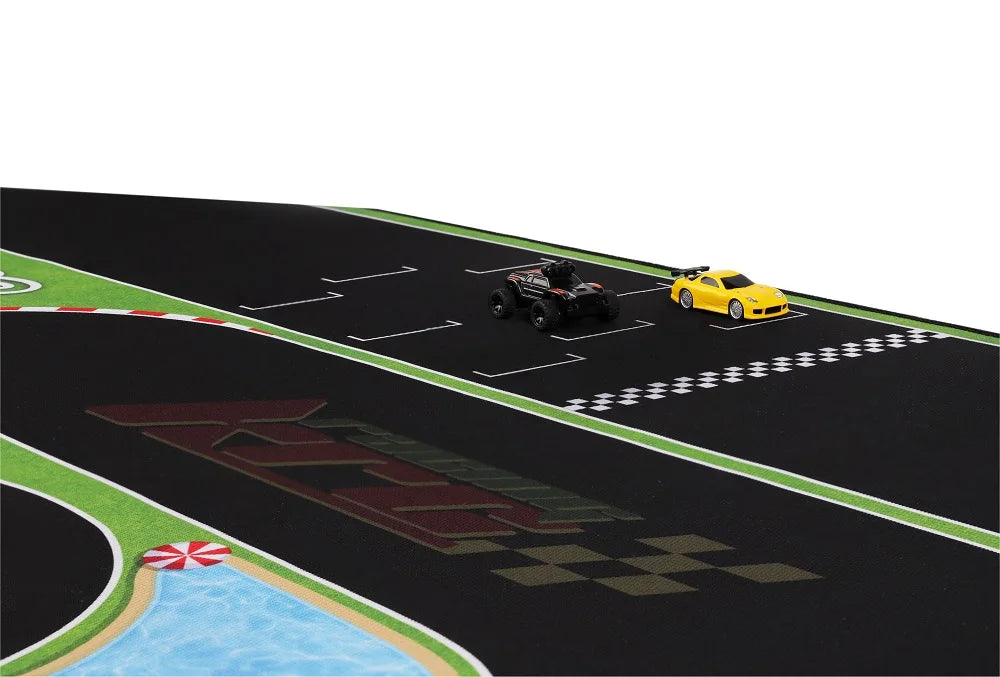 Two 1:76 RC mini toy cars, one black and one yellow, race on the Lacatang Shop's Portable Turbo Racing Rubber Track Mat (1600x900mm) featuring a starting grid, track markings, a checkered pattern, and a water-like section for extra fun.