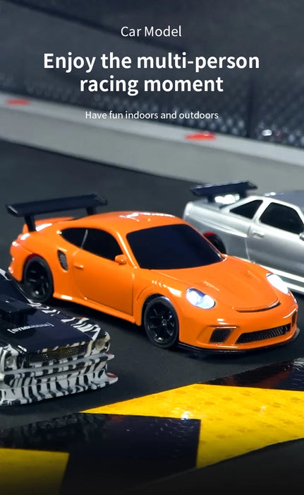 A close-up of 1/43 RC Car Mini Racing Cars from Lacatang Shop racing on a track, featuring an orange sports car in the foreground. In the background, there are other 2.4G Radio Control Drift Cars and a fenced barrier. The text above reads, "1/43 RC Car Mini Racing Cars by Lacatang Shop. Enjoy the multi-person racing moment. Have fun indoors and outdoors.