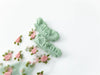 Lacatang Shop's Vintage Floral Lace Ruffle Socks for Women combine kawaii Harajuku style with sheer crystal silk. They feature green ruffled cuffs and charming embroidered pink roses with green leaves on a crisp white background, offering an ultra-thin, transparent finish.