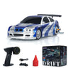 A blue and silver Gifts Outdoor Toys 1/43 RC Mini Race Car 2.4g Radio Control Drift Car 4WD High-Speed Motor Vehicle Model for Boys TH23884 is displayed with a black wireless controller, a USB charging cable, four spare tires, a red marker cone, and its packaging box. The box features images and information about the high-speed model toy and the brand 