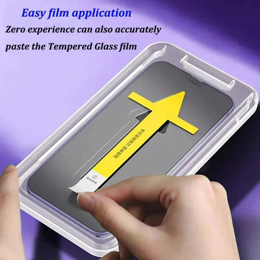 A person is using a screen protector application tool to install the 1-2Pc 8K High End Tempered Glass For iPhone 14 13 12 11 Pro Max XS MAX. The image includes a caption that reads: "Easy film application by AliExpress - Zero experience can also accurately paste the tempered glass film.