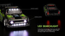 Close-up of two WLtoys 1:28 284131 284161 Racing Mini RC Cars from Lacatang Shop, each equipped with LED lights. The car in the foreground features roof lights and headlights accented with text annotations pointing to "ROOF LIGHT" and "HEADLIGHT." The caption reads, "Under the novel design, lithium battery-powered LED searchlights and headlights make driving at night more interesting.