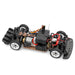 A detailed view of the WLtoys 1:28 284131 284161 2.4G Racing Mini RC Car, capable of reaching speeds of 30KM/H, with visible components including the motor, wiring, lithium battery, suspension, and four wheels. The body is absent, providing a clear look at the internal structure and mechanical parts manufactured by Lacatang Shop.