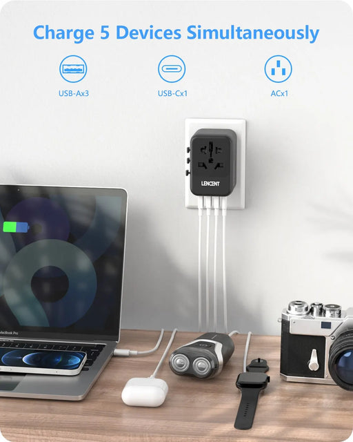 Image of a LENCENT Universal Travel Adapter from AliExpress, plugged into a wall outlet, charging five devices simultaneously: a laptop, earbuds, a camera, a smartwatch, and another device. Featuring three USB-A ports, one USB-C port with PD charging capability. The 8-in-1 international power adapter with interchangeable plugs reads: "Charge 5 Devices Simultaneously.