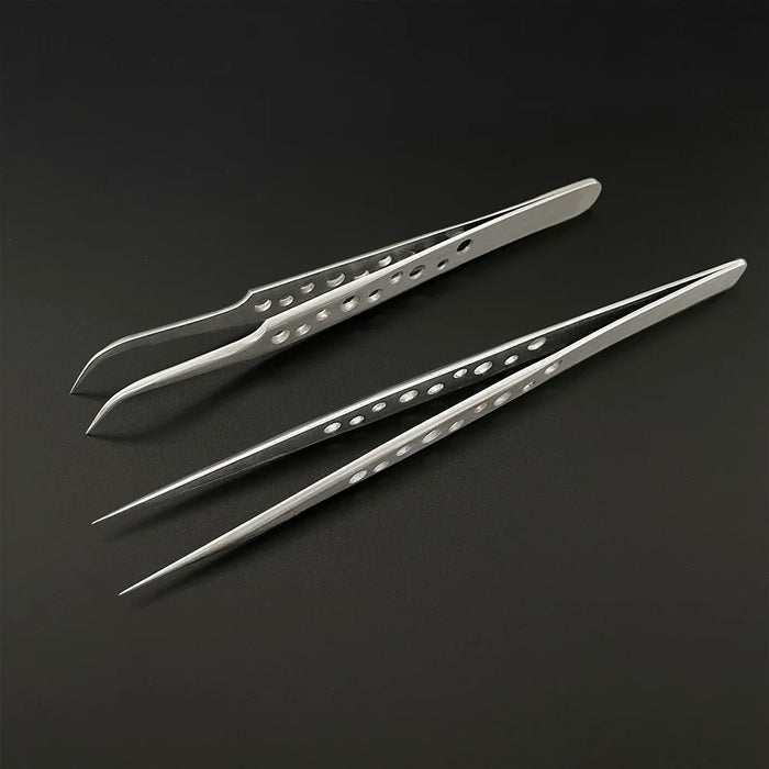 Two pairs of AliExpress Industrial Tweezers Electronics Anti-static Curved Straight Tip with hole patterns on the polished stainless steel handles are displayed on a dark surface. One pair has pointed tips, while the other pair has curved tips designed for precision tasks.