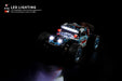 A Lacatang Shop WLtoys 1:28 284131 284161 2.4G Racing Mini RC Car, featuring large off-road tires and LED headlights, is illuminated against a dark background. Text in the top left corner reads, "LED Lighting. LED headlights, domineering appearance. More interesting to watch at night." This high-speed remote control drift toy for children is equipped with a powerful lithium battery for extended playtime.