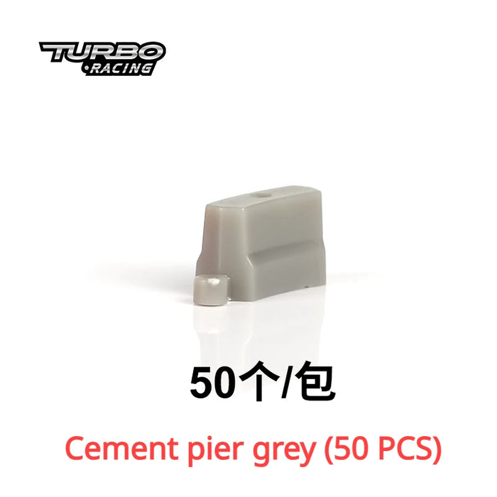 The image showcases a small grey cement pier with the "Turbo Racing" logo, ideal for the TURBO RACING 1:76 Remote Control Car Race Track Set. The text includes "50个/包" and "Cement pier grey (50 PCS)" in red, set against a white background. Available at Lacatang Shop.