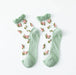 Lacatang Shop's Vintage Floral Lace Ruffle Socks for Women feature a Kawaii Harajuku style with mint green, ultra-thin transparent silk, ruffled cuffs, and a floral pattern of pink roses and green leaves.