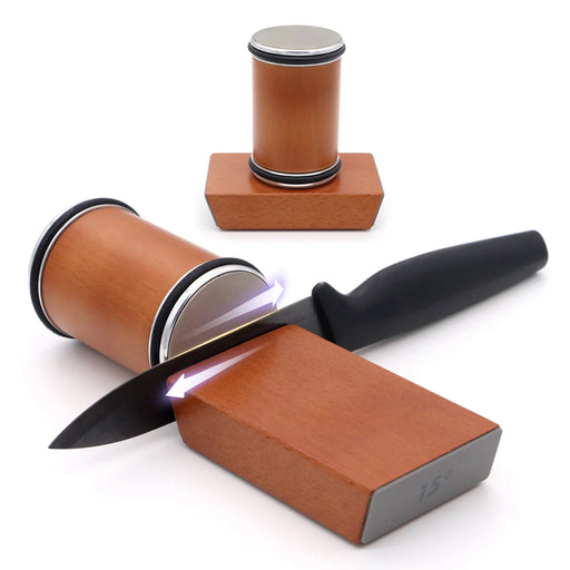 A knife is angled and shown being sharpened using the AliExpress Rolling Knife Sharpener Tool Roller Edge Countertop Knife Sharpener. Another identical sharpener is in the background. The setup highlights the kitchen knife sharpening process with this double-ended device, making it part of a Premium Knife Sharpener Kit.