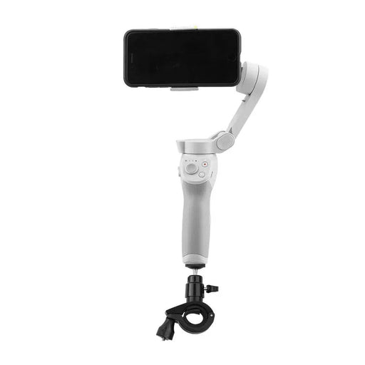 Image of a smartphone mounted on an AliExpress Aluminum Alloy Bicycle Stand Holder Clip Clamp Supportor for DJI Osmo. The device has a clamp to secure the phone, multiple buttons on the handle, and is attached to a black tripod mount at the bottom.