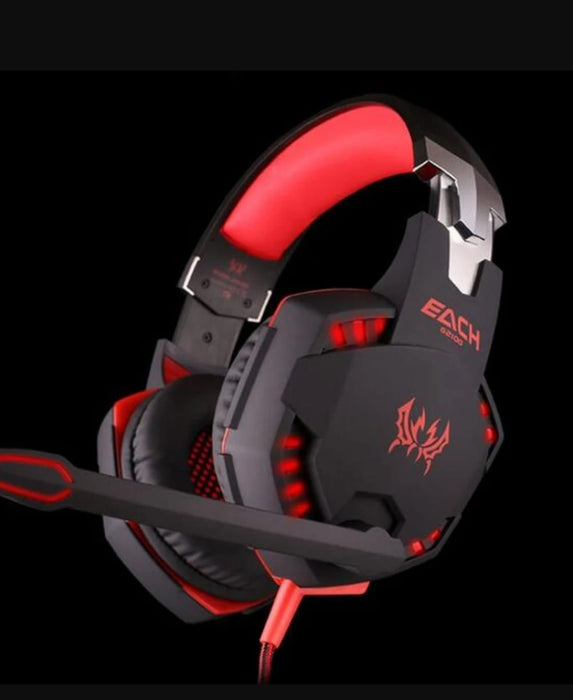 A Yellow Pandora Ninja Dragon Stealth G21Z LED Vibration Gaming Headset with black and red accents, featuring a padded headband, large over-ear cups with red LED lighting and vibration, and a flexible microphone on the left side. The headset boasts a futuristic design with the name "EACH" printed on the side.