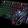 Here's a close-up image of the Ninja Dragons Z4 104 Keys LED Flame Gaming Keyboard with 2000 DPI mouse by Yellow Pandora. The keyboard boasts rainbow backlit keys with well-lit letters, while the mouse features an illuminated, intricate black and white pattern. The dark background further enhances their mechanical feel and glowing design.