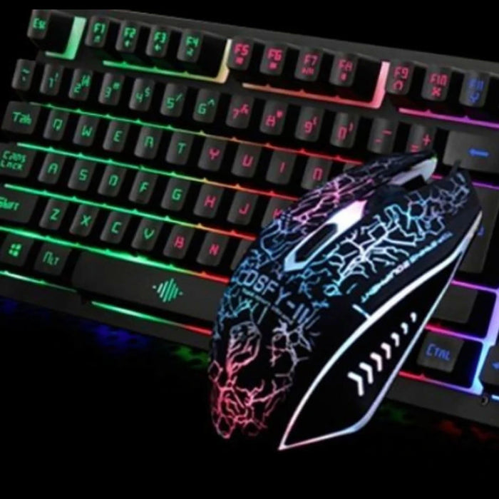 Here's a close-up image of the Ninja Dragons Z4 104 Keys LED Flame Gaming Keyboard with 2000 DPI mouse by Yellow Pandora. The keyboard boasts rainbow backlit keys with well-lit letters, while the mouse features an illuminated, intricate black and white pattern. The dark background further enhances their mechanical feel and glowing design.